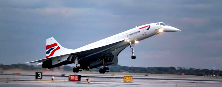 Aircraft taking off with navigation and landing lights on
